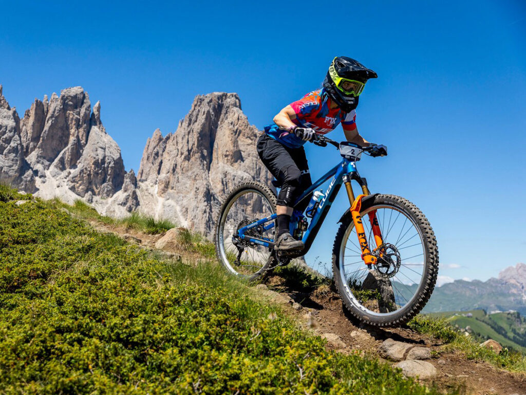 Simona Kuchynkova rides her CUBE Stereo ONE55 down a steep downhill section at the Enduro World Cup in Canazei